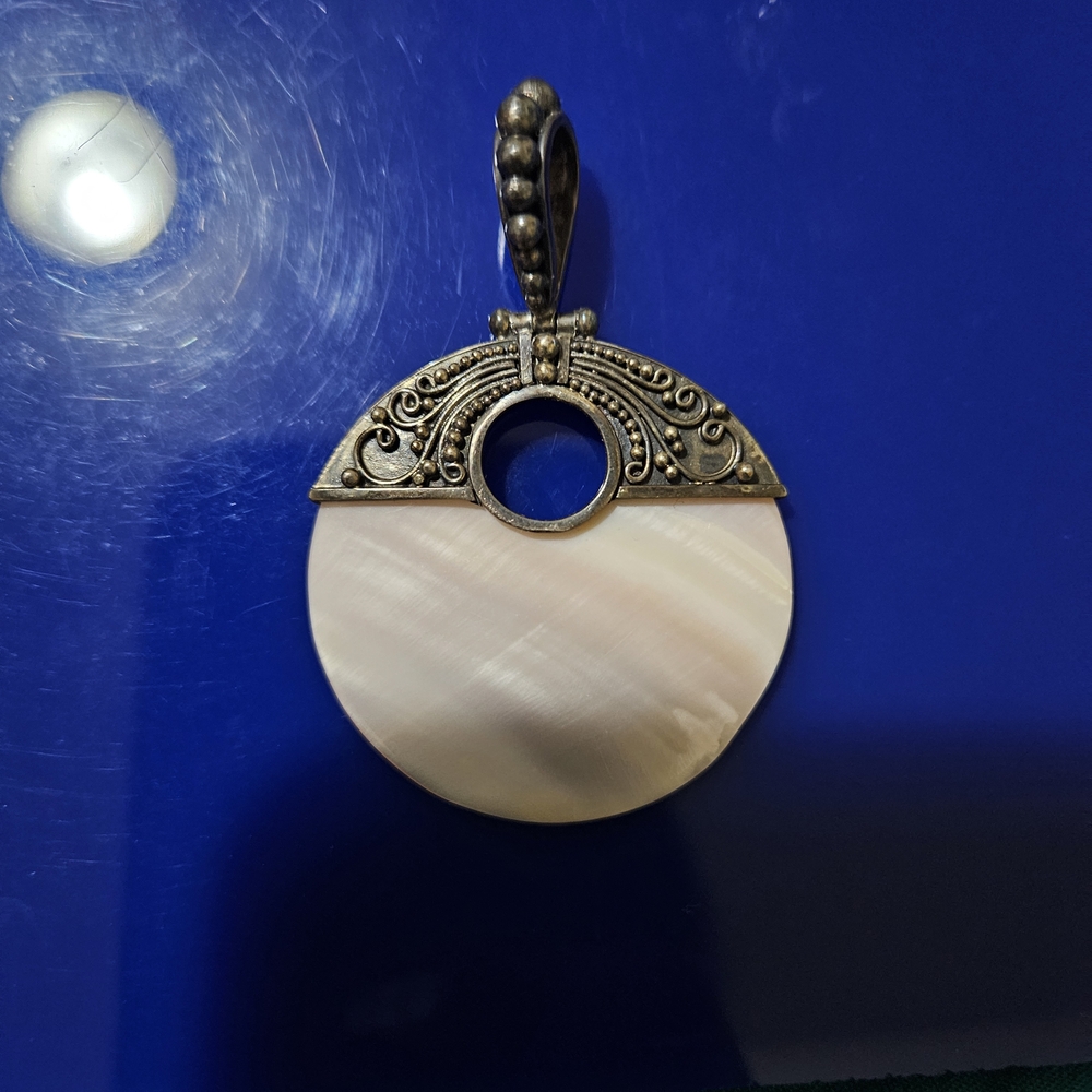 Elegant Cream Pendant with Antique Silver Detailing